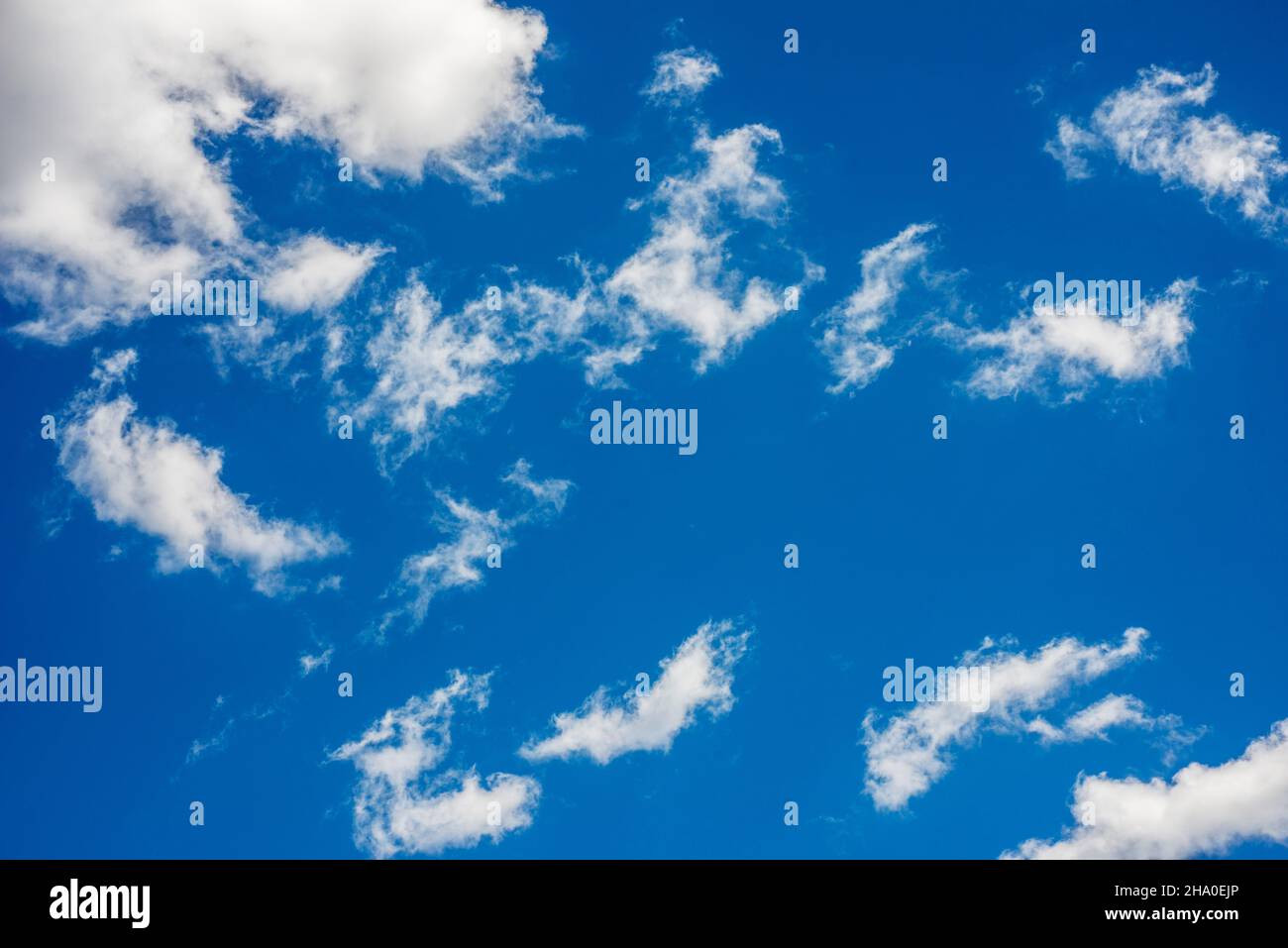 Elongated cloud in big blue sky Stock Photo