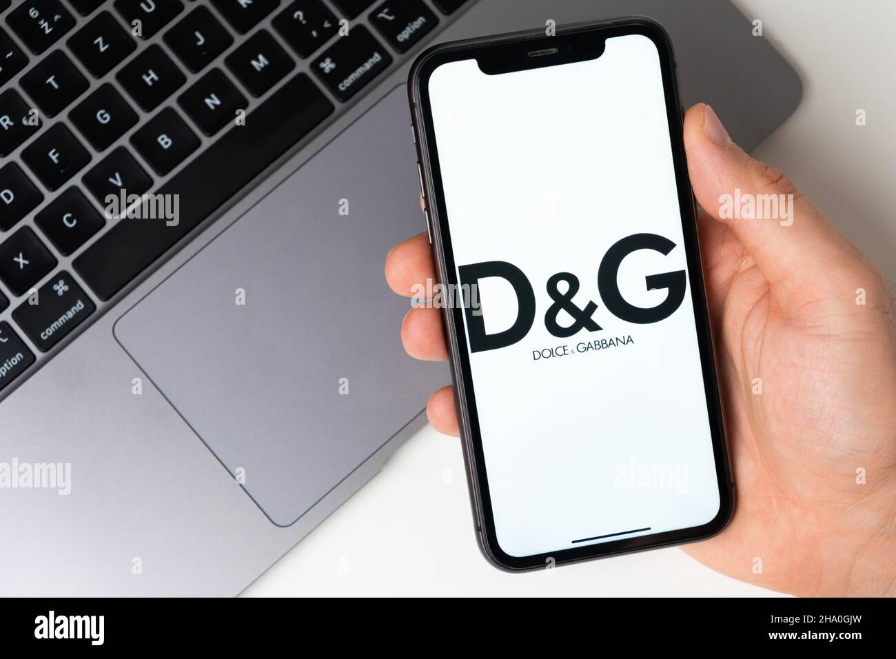 Dolce and Gabbana application for buying clothes, shoes and accessories online. Online shopping using a mobile phone or laptop November 2021, San Francisco, USA Stock Photo