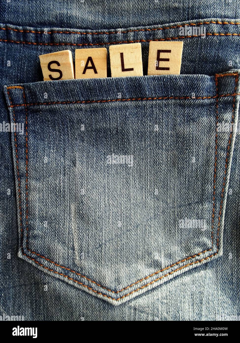 Word SALE in worn jeans pocket, sale concept Stock Photo