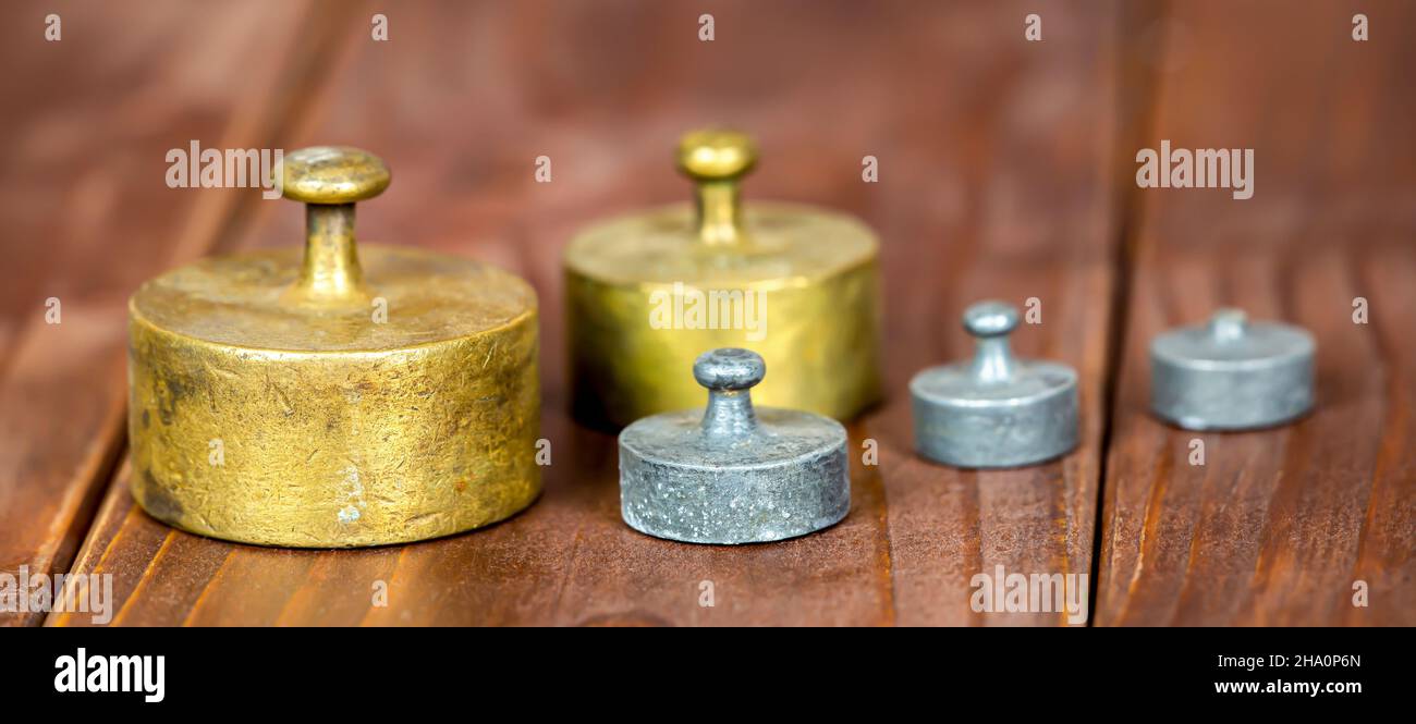 Gold, copper and silver color antique rustic weights banner Stock Photo ...