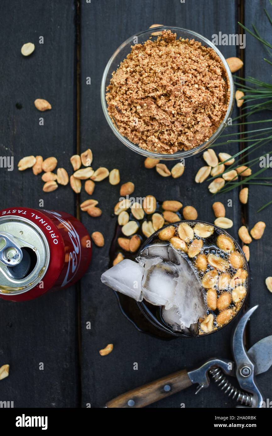 Bourbon, peanuts and Coke Stock Photo Alamy