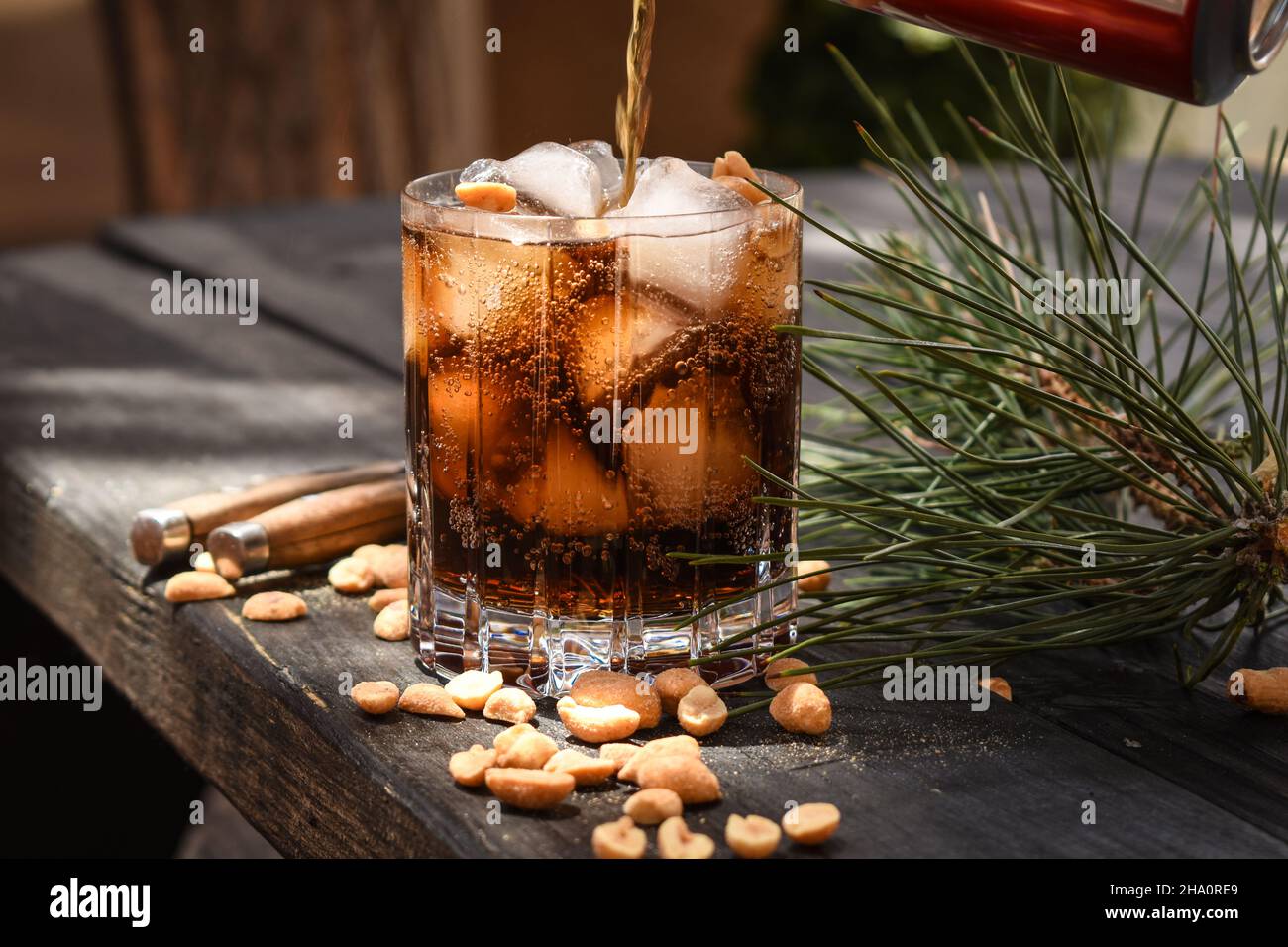 Bourbon, peanuts and Coke Stock Photo Alamy