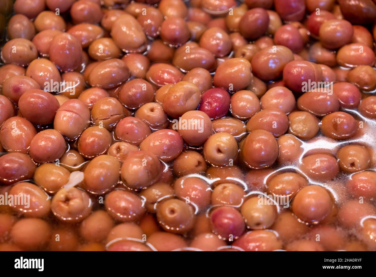organic raw olives with olive oil in the shop Stock Photo Alamy