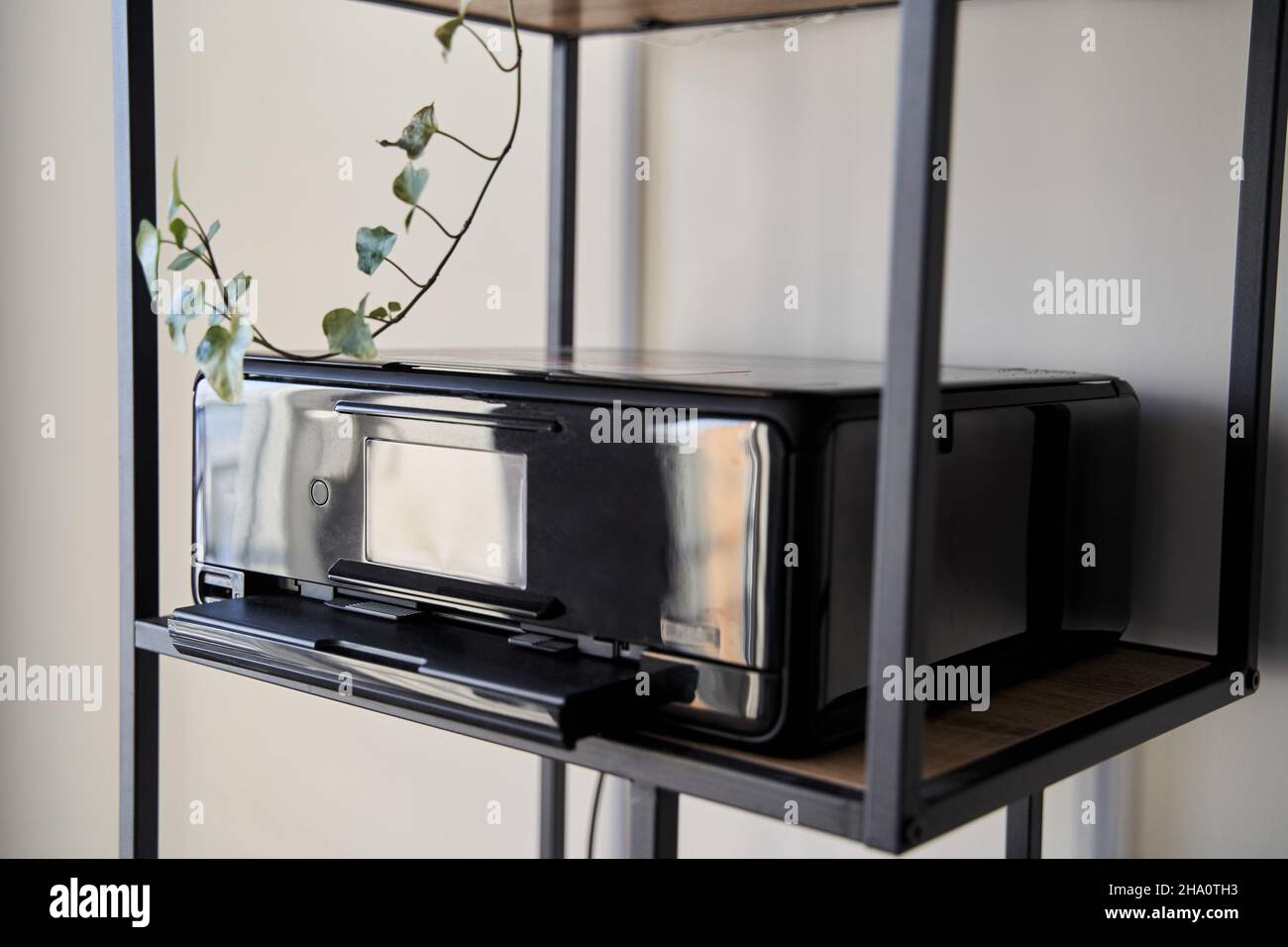 Black inkjet printer is on the shelf Stock Photo