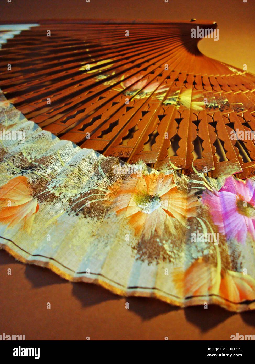 Authentic Spanish Fan on brown background Stock Photo - Alamy