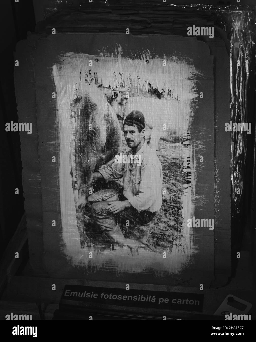 BUCHAREST, ROMANIA - Aug 25, 2021: A beautiful grayscale shot of a painting of a man on a farm Stock Photo