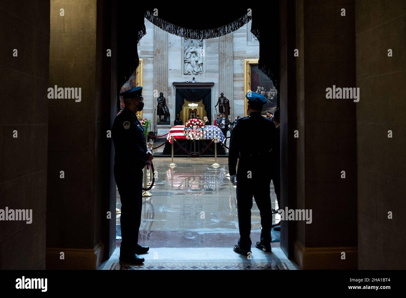 Washington, United States. 09th Dec, 2021. Two United States Capitol Police Officers look on as the casket of former Senator Bob Dole lies in state in the Rotunda of the U.S. Capitol. Credit: SOPA Images Limited/Alamy Live News Stock Photo