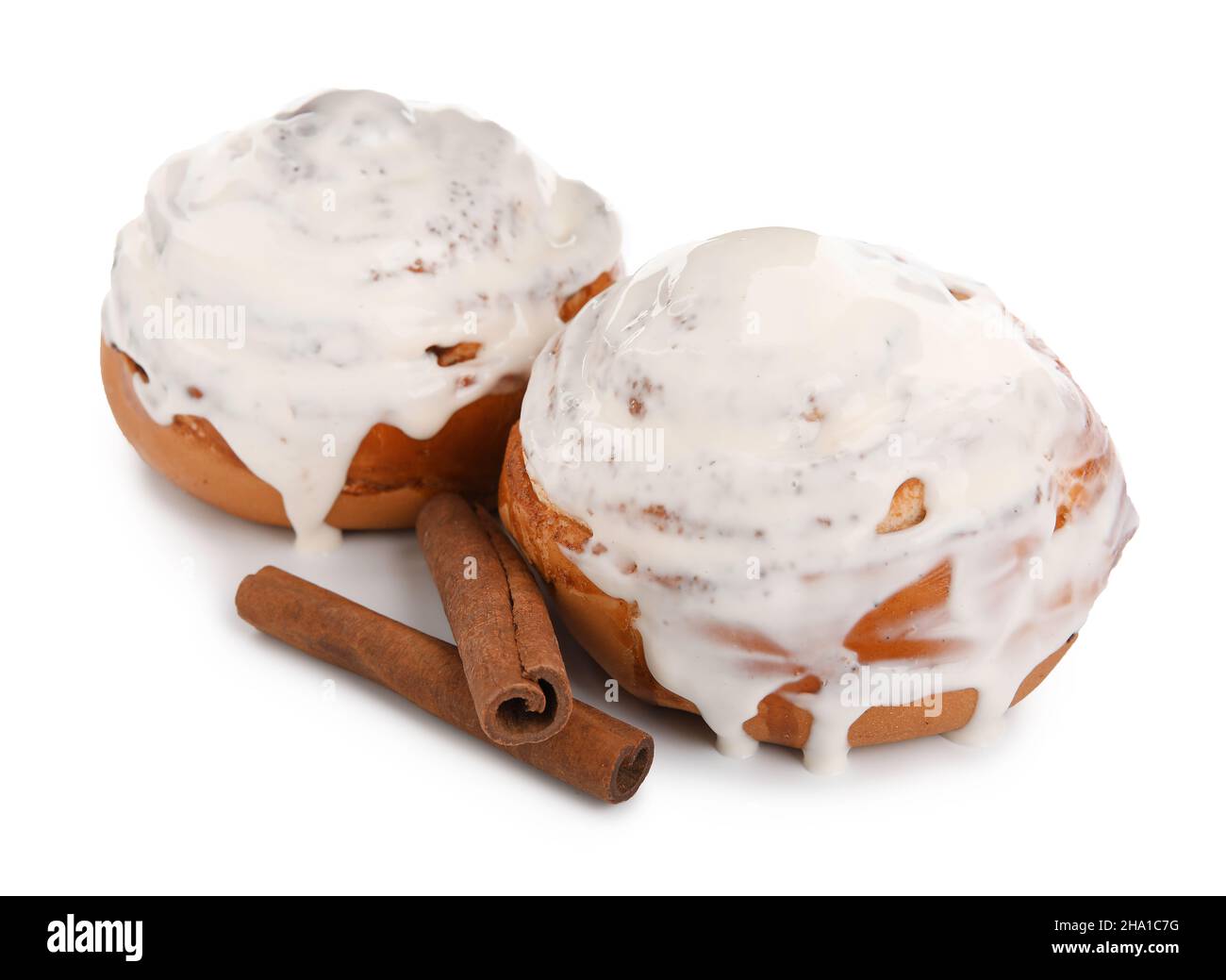 Tasty cinnamon rolls with cream on white background Stock Photo - Alamy