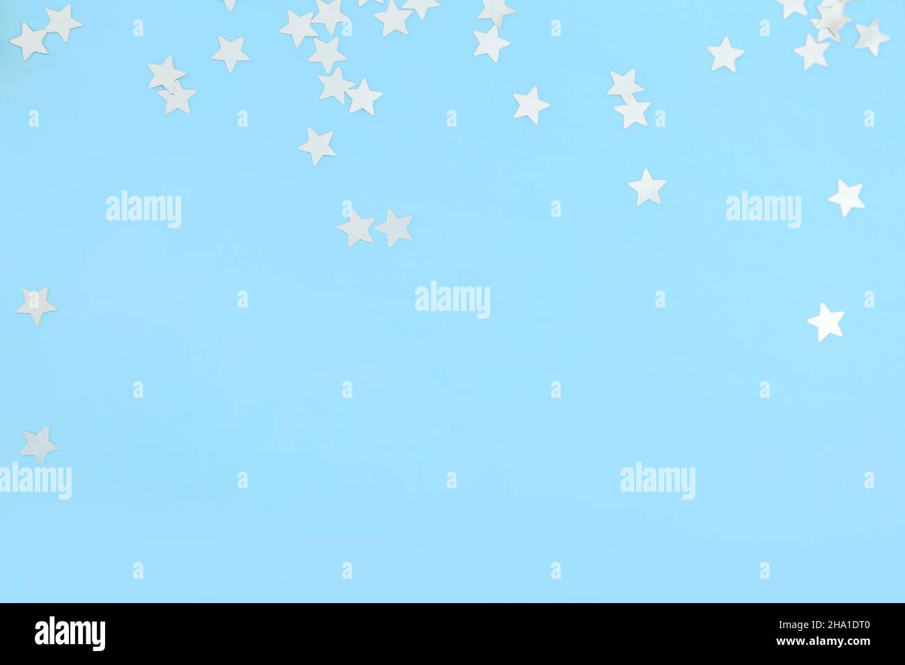 Beautiful confetti on blue background Stock Photo - Alamy