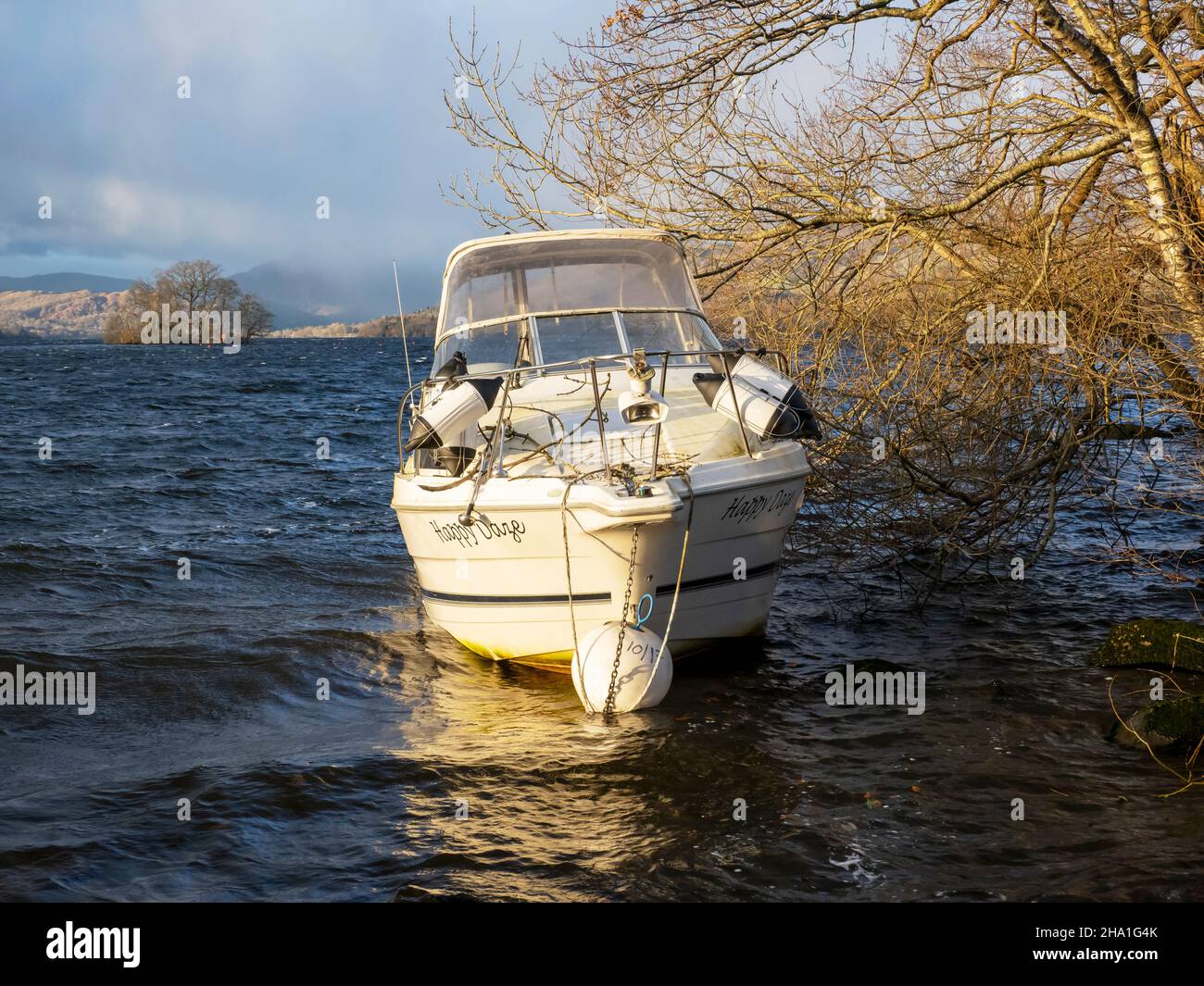 A boat ripped off its moorings and blown ashore by Storm Arwen, on Lake