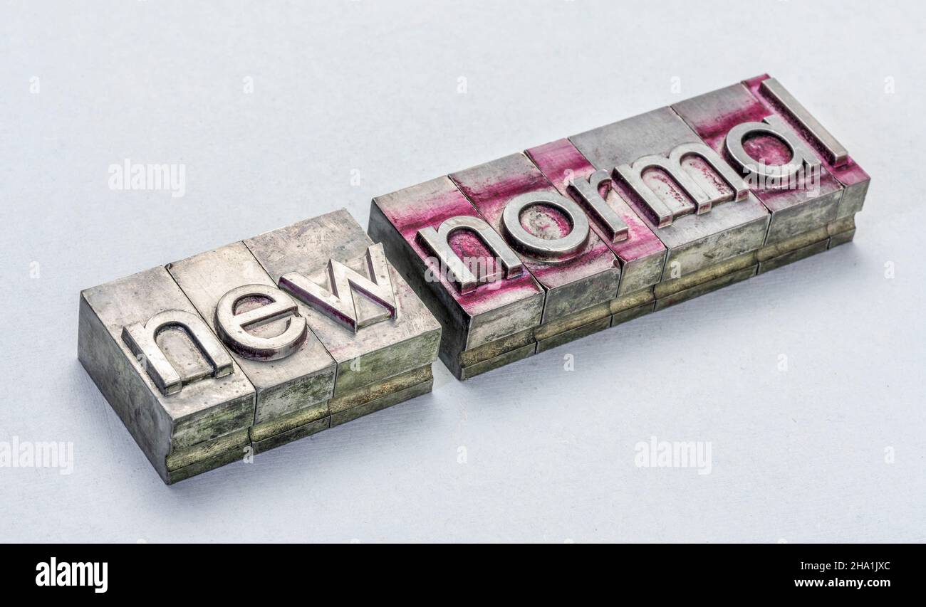 new normal text in grunge letterpress metal type, conditions after financial crisis or human behavior's changes during and after coronavirus covid-19 Stock Photo