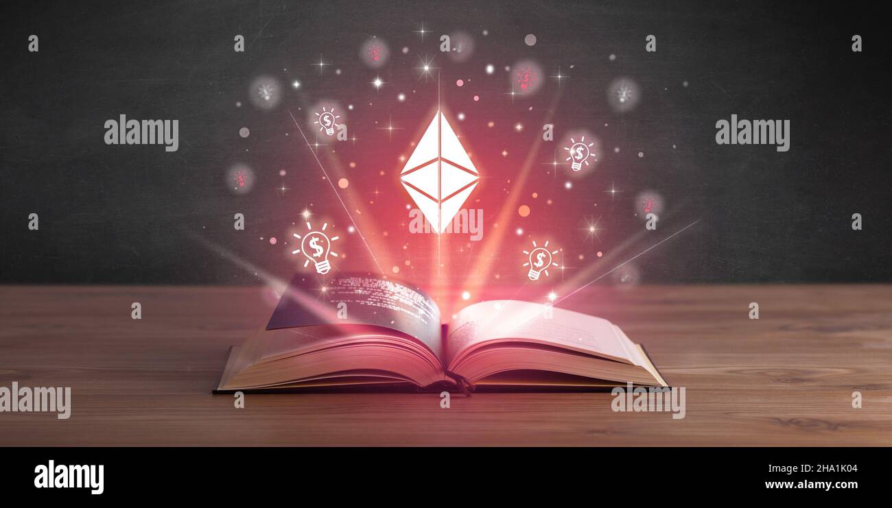 Open book with currency icons above Stock Photo - Alamy