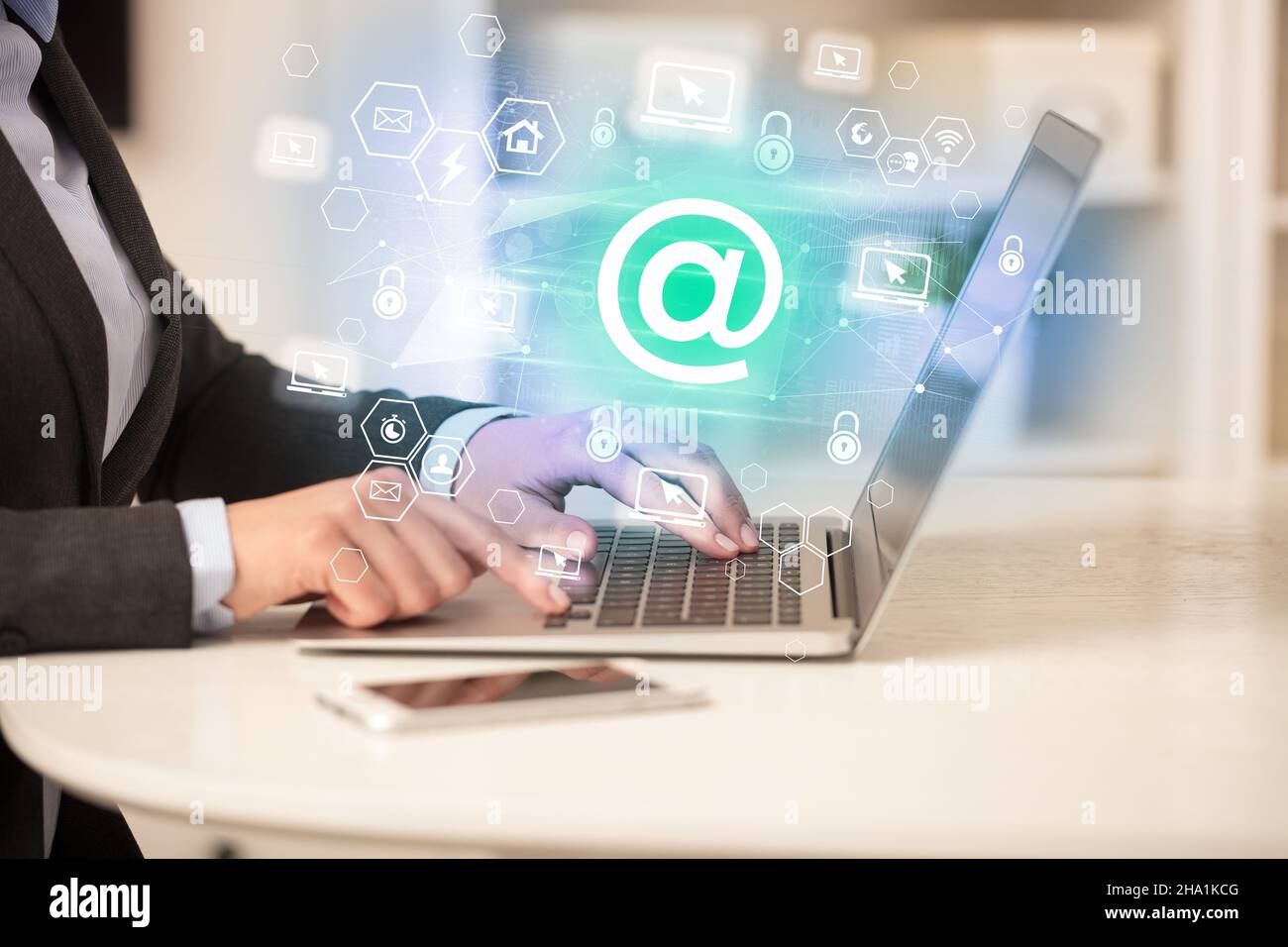 Hands working on laptop with digital icons concept Stock Photo