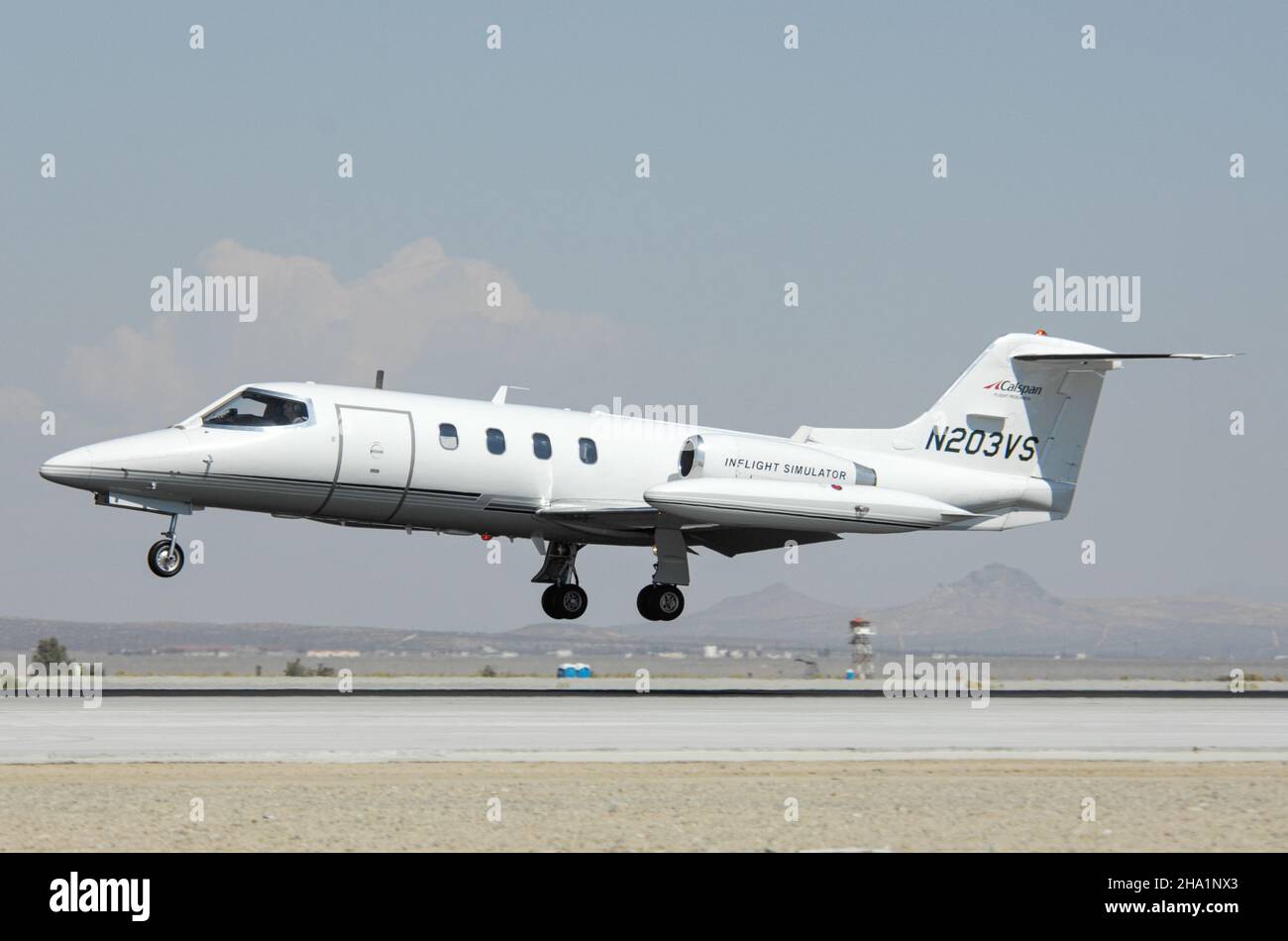 CALSPAN Learjet landing at Edwards Air Force Base in California Stock Photo