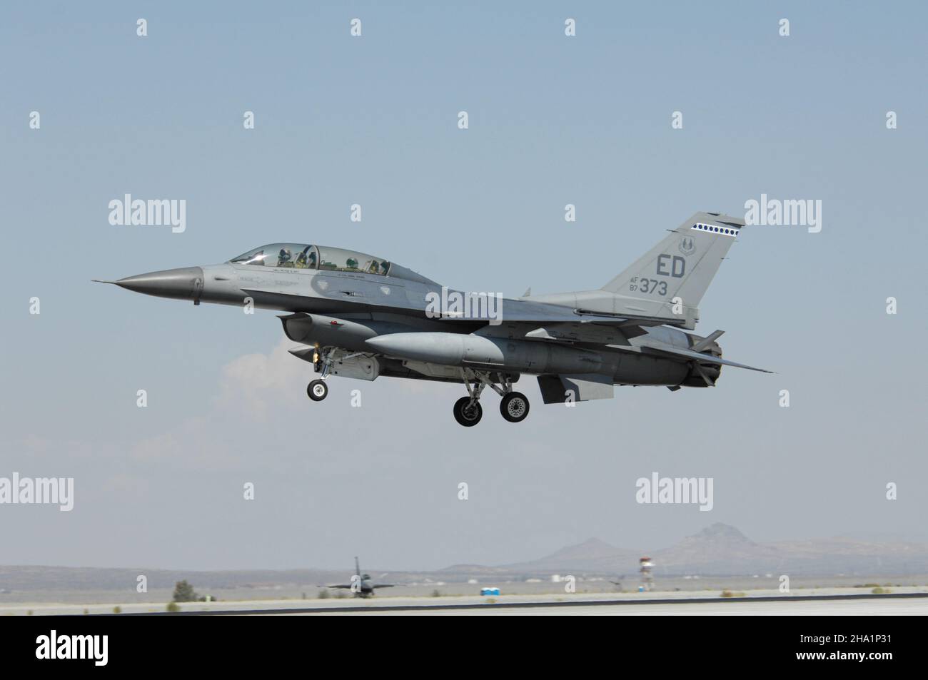 United States Air Force F-16 Fighting Falcon landing at Edwards Air Force Base in the Mojave desert of California Stock Photo