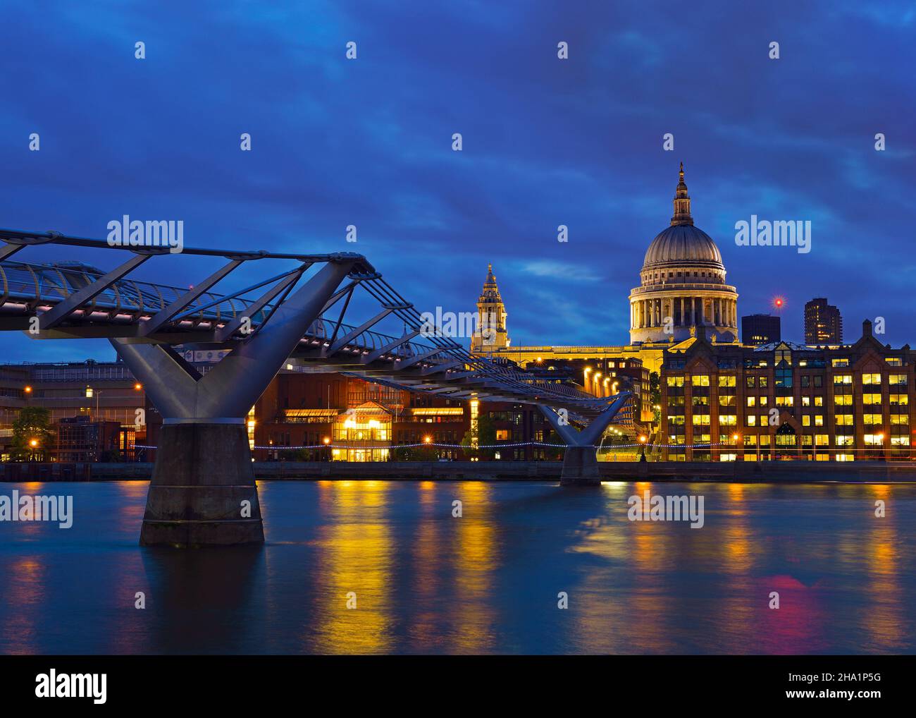 Millennium Bridge and St Pauls Cathedral at Dusk, London, United Kingdom Stock Photo