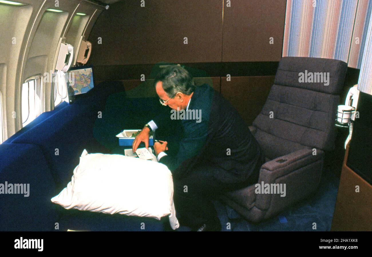 Vice President GW Bush looks over speaking prompts between campaign stops on the campaign for his second term.  he The campaign in Florida in 1988 aboard Air Force Two.Photograph by Dennis Brack. bb80 Stock Photo