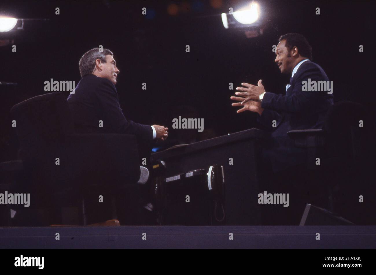 Photographers  in Athens covering Bush 41.  Wally McNamee,Dennis Cook Tim Clary, Gary Hershorn,Diana Walker, Dennis Brack,Charles Arbushaw  Dan Rather in the CBS anchor booth interviewing Rev. Jesse Jacksopnm at  the 1988 Democratic Convention.Photograph by Dennis Brack. bb80 Stock Photo