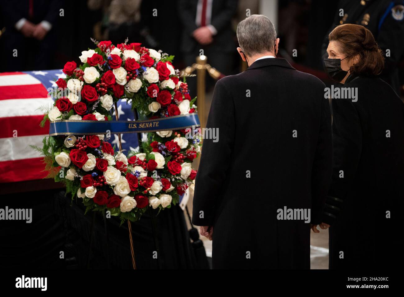 Former United States Senator Chuck Robb (Democrat of Virginia), left, and wife Lynda Bird Johnson Robb, the eldest daughter of the 36th U.S. President Lyndon B. Johnson, pay their respects to former Senator Robert J. Dole (R-KS) as he lies in state at the Rotunda of the U.S. Capitol in Washington, DC on Thursday, December 9, 2021. Credit: Sarahbeth Maney/Pool via CNP Stock Photo