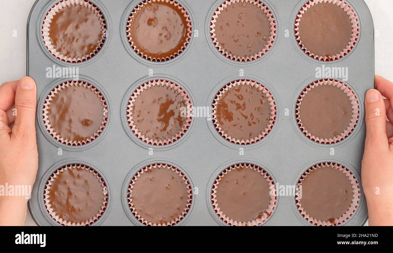 Chocolate cupcakes recipe. Cupcake pan lined with paper liners, and
