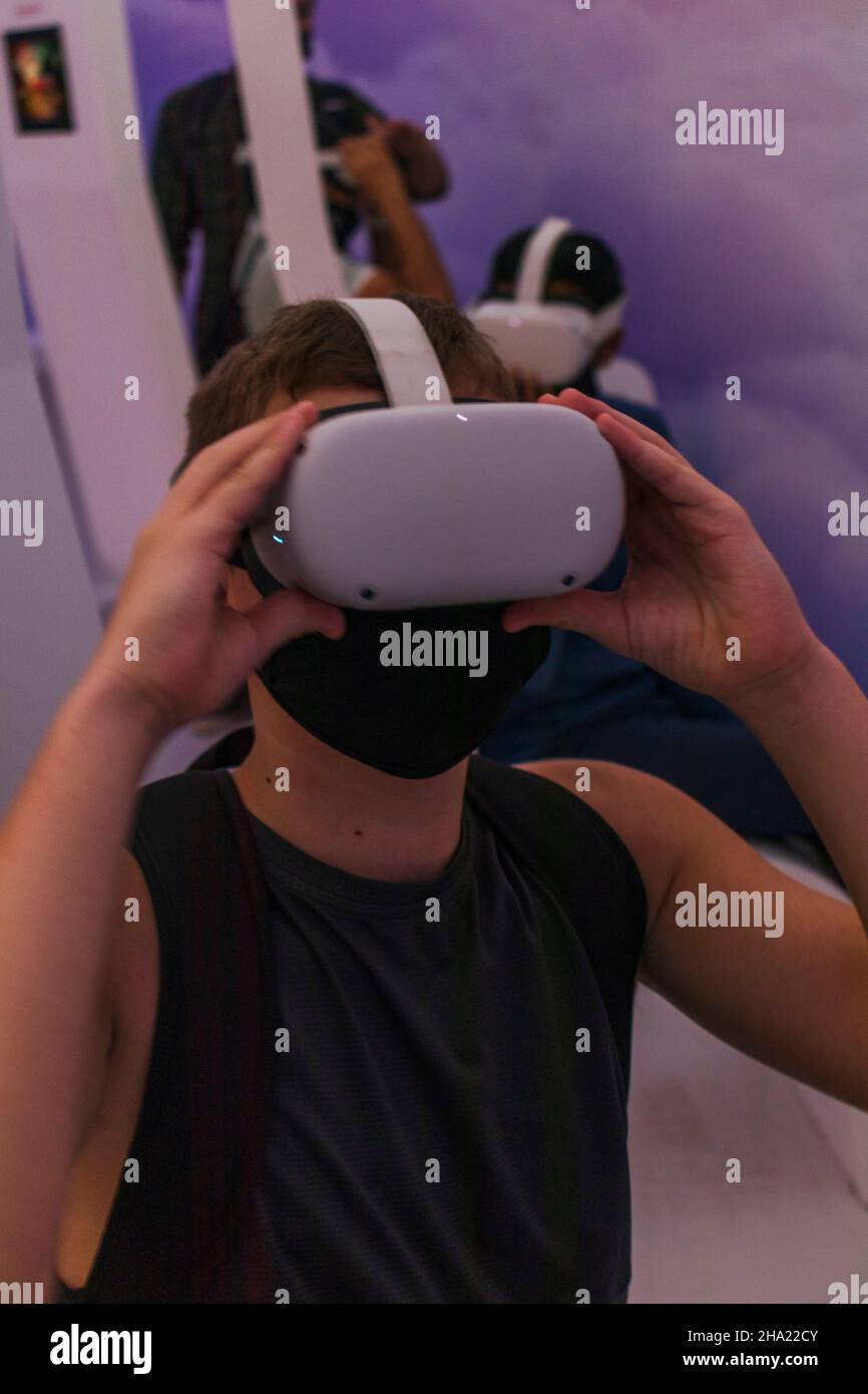 Teenage boy in the mask with VR set Stock Photo Alamy