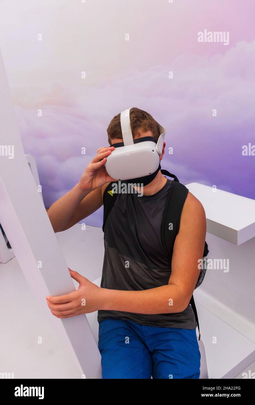 Teenage boy in the mask with VR set Stock Photo Alamy