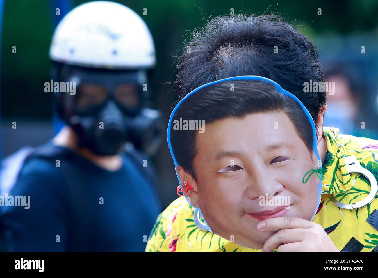 Taipei, Taipei, Taiwan. 10th Dec, 2021. A demonstrator wearing a mask with the face of Chinese president Xi Jinping, during a protest boycotting the Beijing Winter Games 2022, outside the Bank of China (Taipei Branch), following several diplomatic boycotts of the Games. The United States, Canada, UK, and Australia have pledged not to send officials to attend the Games as a mean to boycott the China, following the disappearance of Chinese tennis player Peng Shuai and human rights crackdowns on Hong Kong and Xinjiang. (Credit Image: © Daniel Ceng Shou-Yi/ZUMA Press Wire) Stock Photo