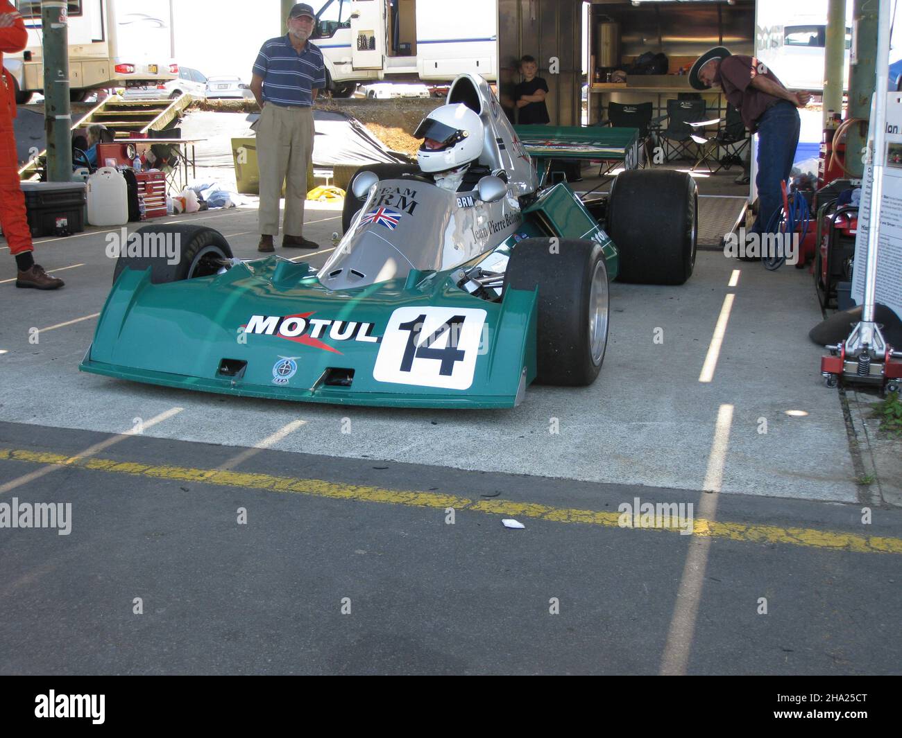 The ex-Jean-Pierre Beltoise #14 BRM P201 owned by Peter and Aaron Burson in the Pukekohe pits at the 2009 Tasman Grand Prix meeting. Lunch time demo. Stock Photo