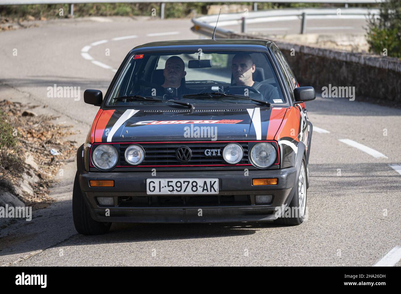 BARCELONA, SPAIN - Nov 11, 2021: A man driving Volkswagen Golf GTI Mk2 ...