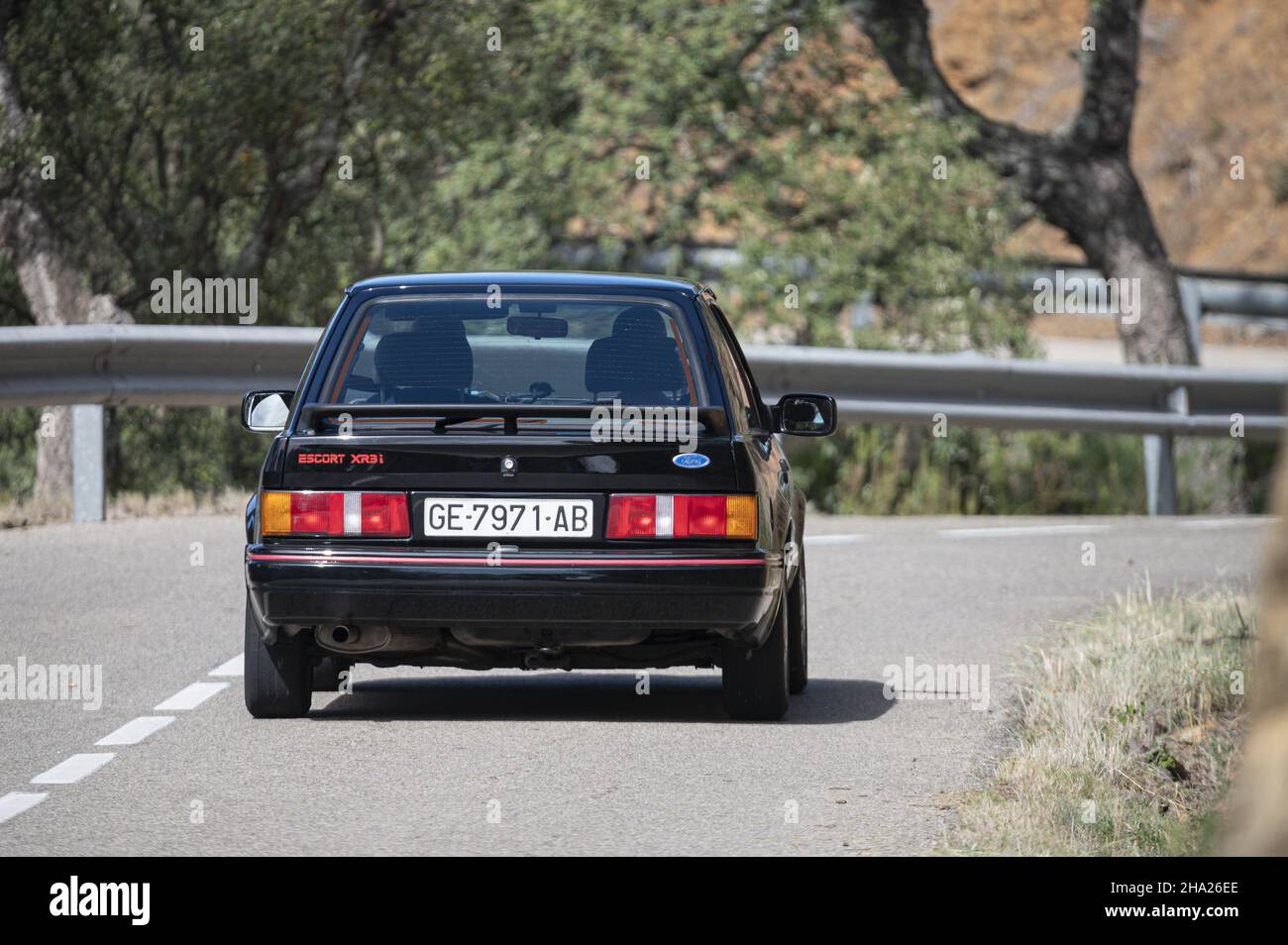 BARCELONA, SPAIN - Nov 11, 2021: A man driving Ford Escort XR3i Mk4 Rallye on a highway in Catalonia, Spain Stock Photo