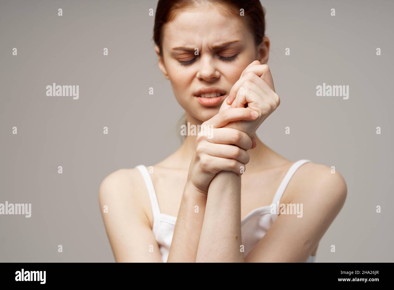 woman arm pain arthritis chronic disease studio treatment Stock Photo woman arm pain arthritis chronic disease studio treatment Stock Photo