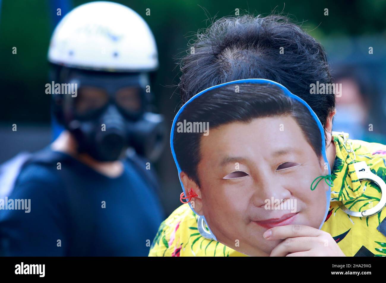 Taipei, Taiwan. 10th Dec, 2021. A demonstrator wearing a mask with the face of Chinese president Xi Jinping, during a protest boycotting the Beijing Winter Games 2022, outside the Bank of China (Taipei Branch), following several diplomatic boycotts of the Games. The United States, Canada, UK, and Australia have pledged not to send officials to attend the Games as a mean to boycott the China, following the disappearance of Chinese tennis player Peng Shuai and human rights crackdowns on Hong Kong and Xinjiang. (Credit Image: © Daniel Ceng Shou-Yi/ZUMA Press Wire) Stock Photo