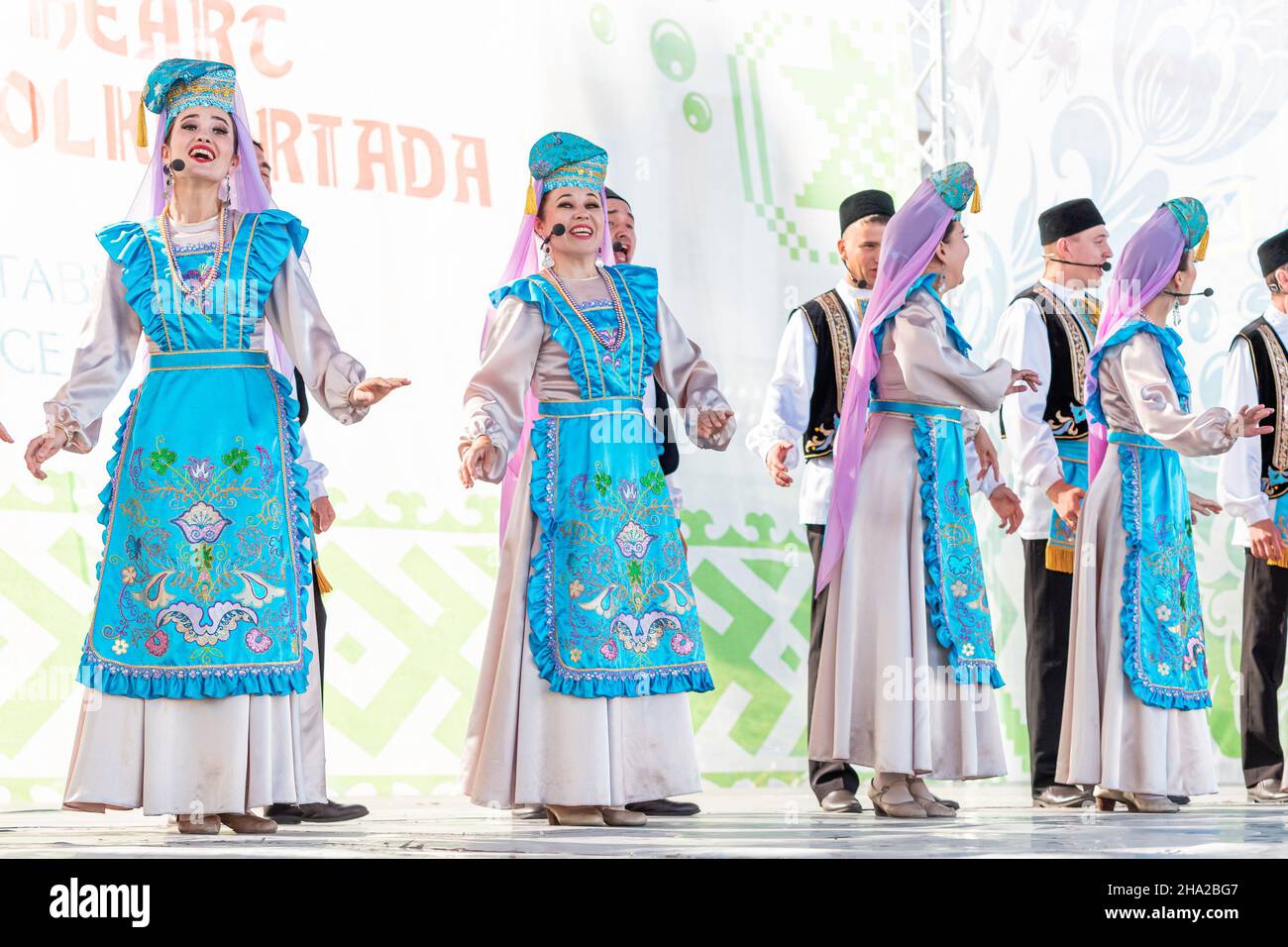06 July 2021, Ufa, Russia: Tatar National Ensemble in traditional clothes dances and sings at the Folkloriada Festival Stock Photo