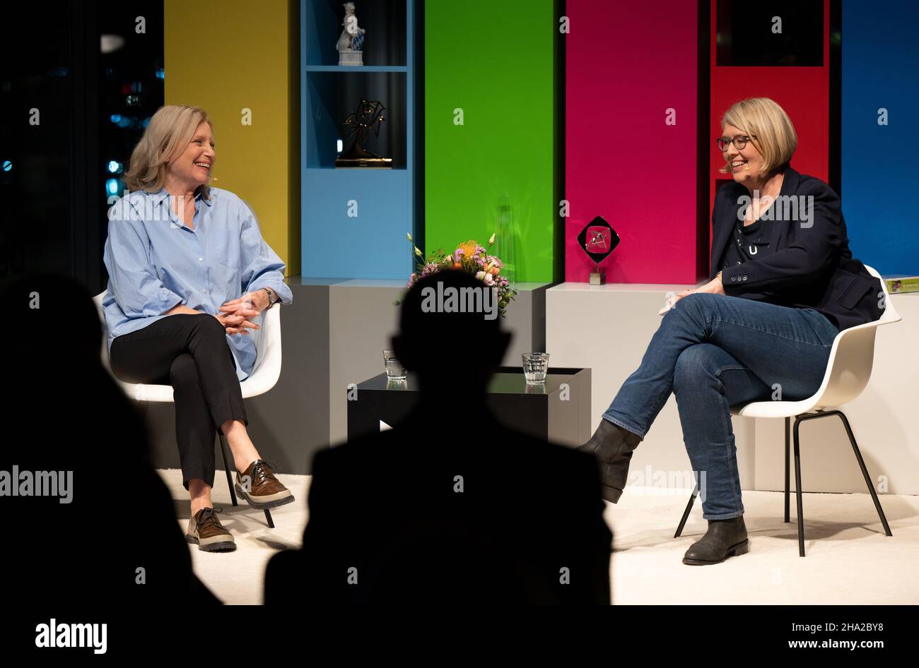 Berlin, Germany. 09th Dec, 2021. Maren Kroymann (l), actress and comedienne, and Klaudia Wick, Head of Audiovisual Heritage - Television at the Deutsche Kinemathek - Museum für Film und Fernsehen, talk during the recording of the programme 'Fernsehsalon' at the Deutsche Kinemathek - Museum für Film und Fernsehen. Kroymann is the inaugural guest of the new format 'Fernsehsalon', to be seen online from 13.01.2022 on the website of the Kinemathek, on the Berlin channel Alex and on other platforms. Credit: Monika Skolimowska/dpa-Zentralbild/dpa/Alamy Live News Stock Photo