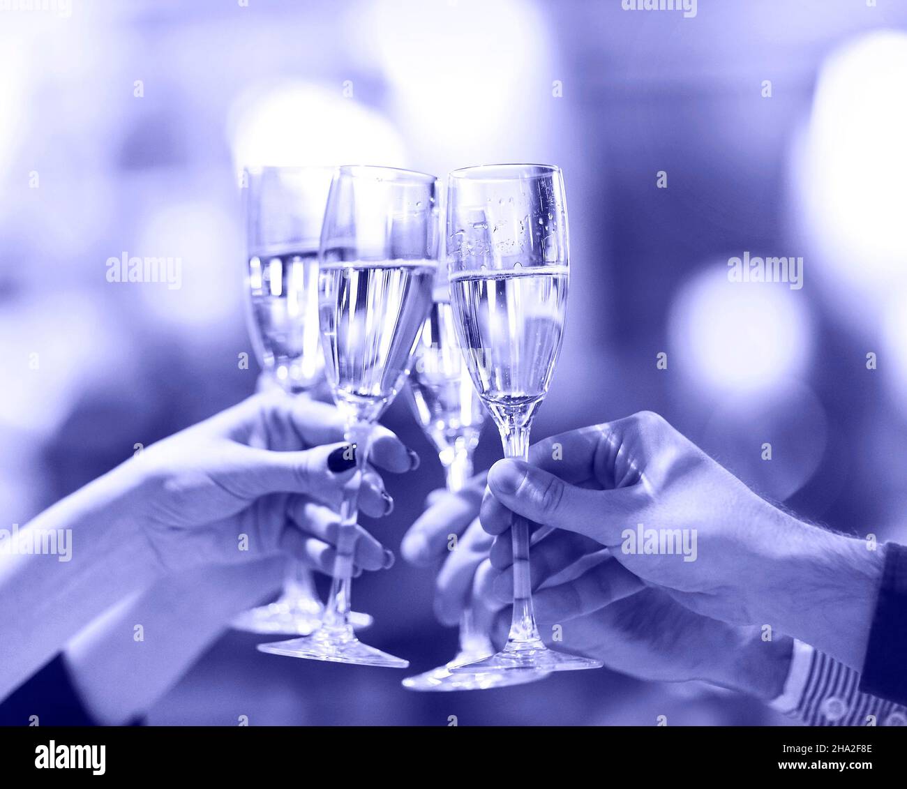 Celebration. People holding glasses of champagne making a toast ...