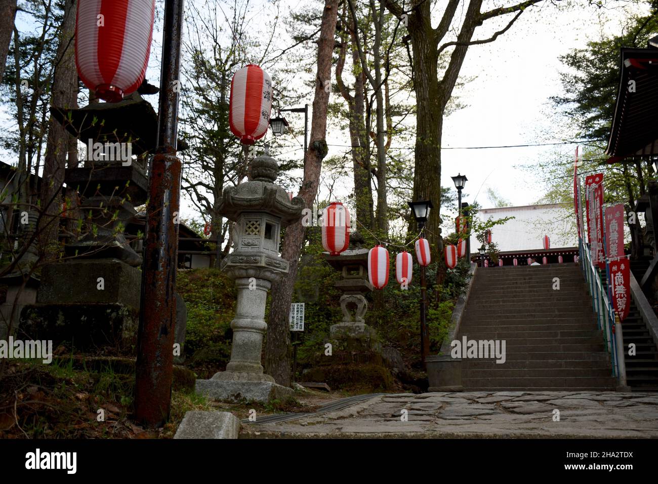 Hanging paper lanterns over stairs at a shrine in Japan Stock Photo