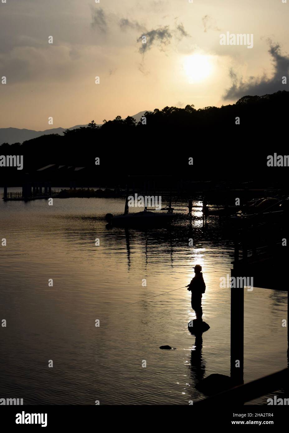 silhouette of man standing in water Stock Photo - Alamy