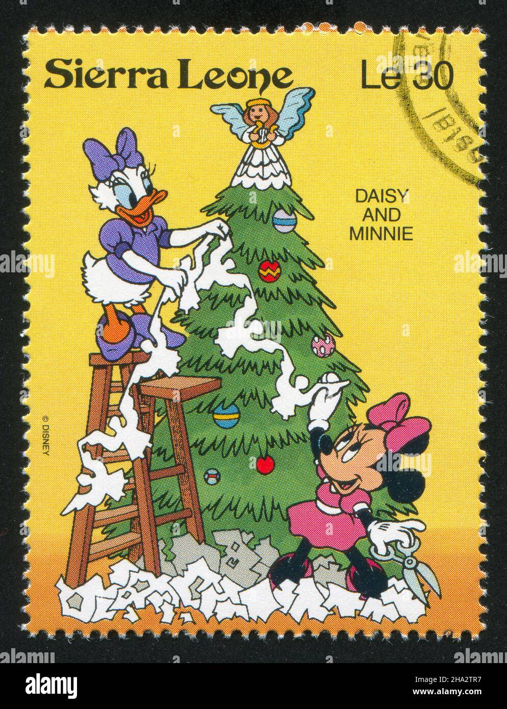 SIERRA LEONE - CIRCA 1992: stamp printed by Sierra Leone, shows Walt Disney Characters in Christmas Scenes, circa 1992. Stock Photo
