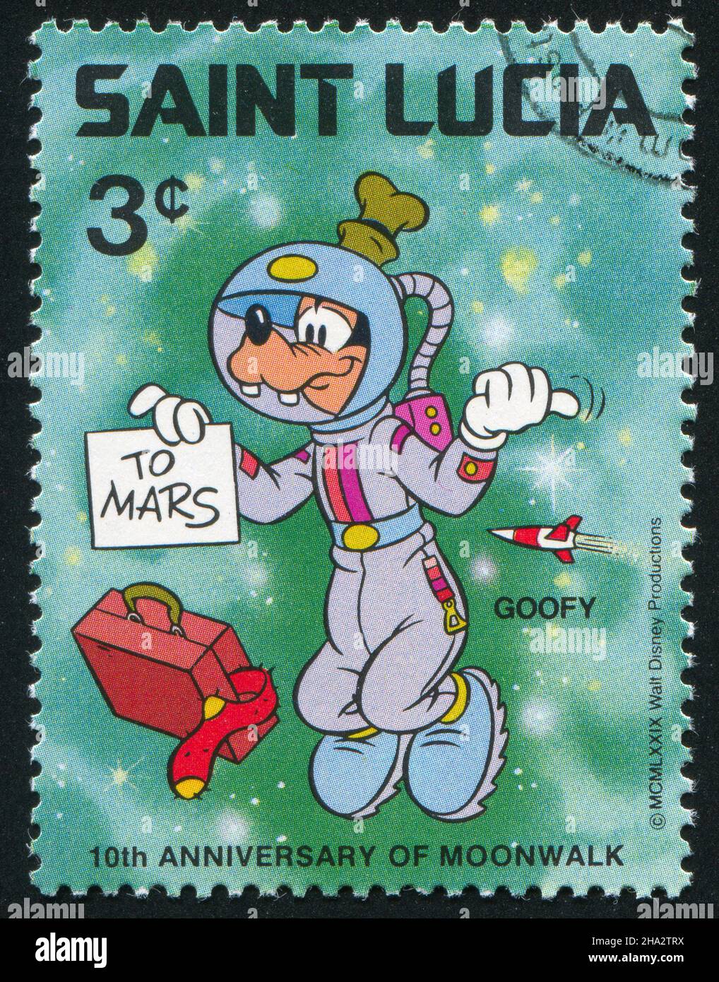 SAINT LUCIA - CIRCA 1980: stamp printed by Saint Lucia, shows shows Walt Disney Characters, Space scenes, Goofy hitch hiking, circa 1980. Stock Photo