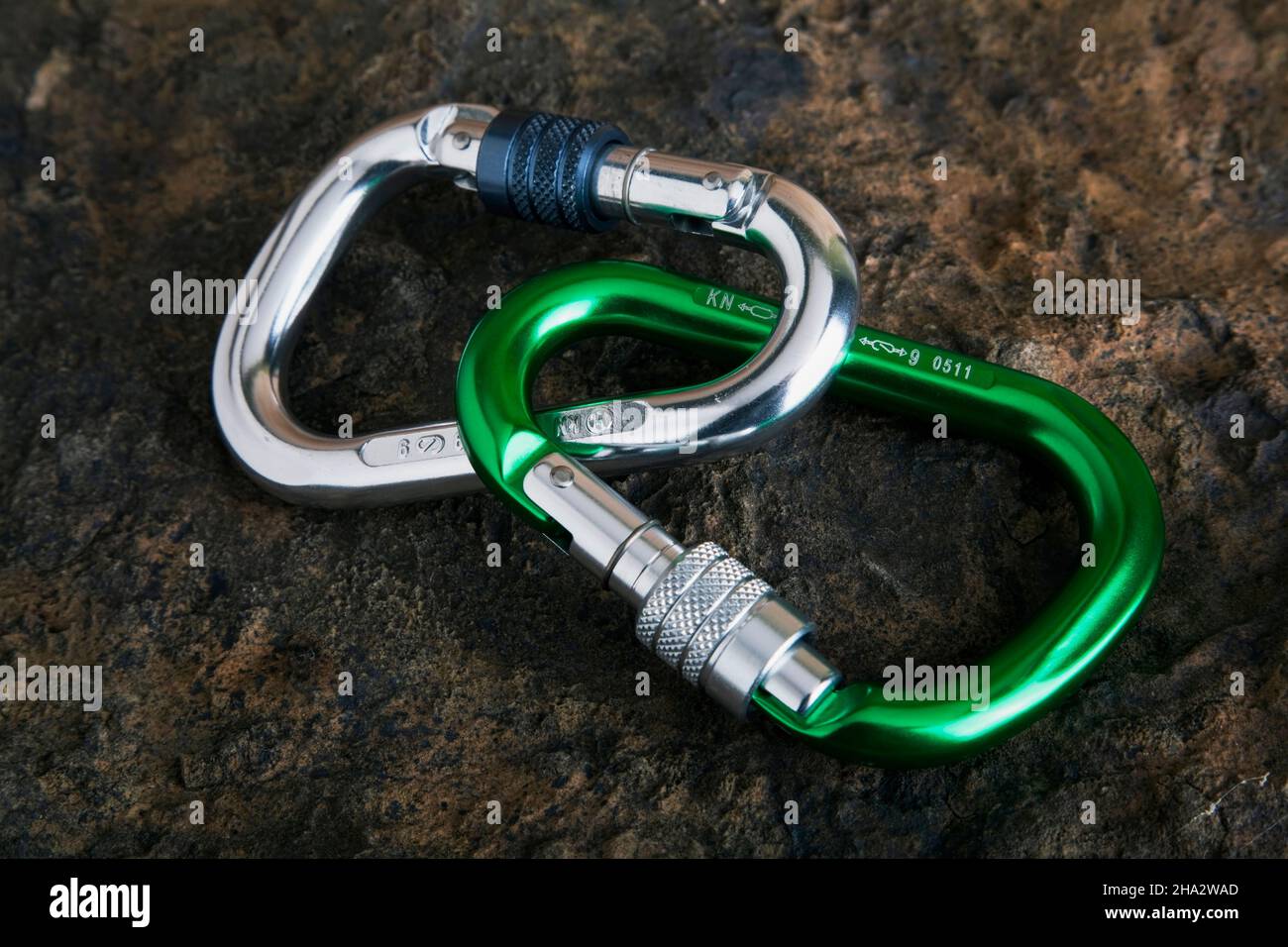 two carabiners on ston surface Stock Photo