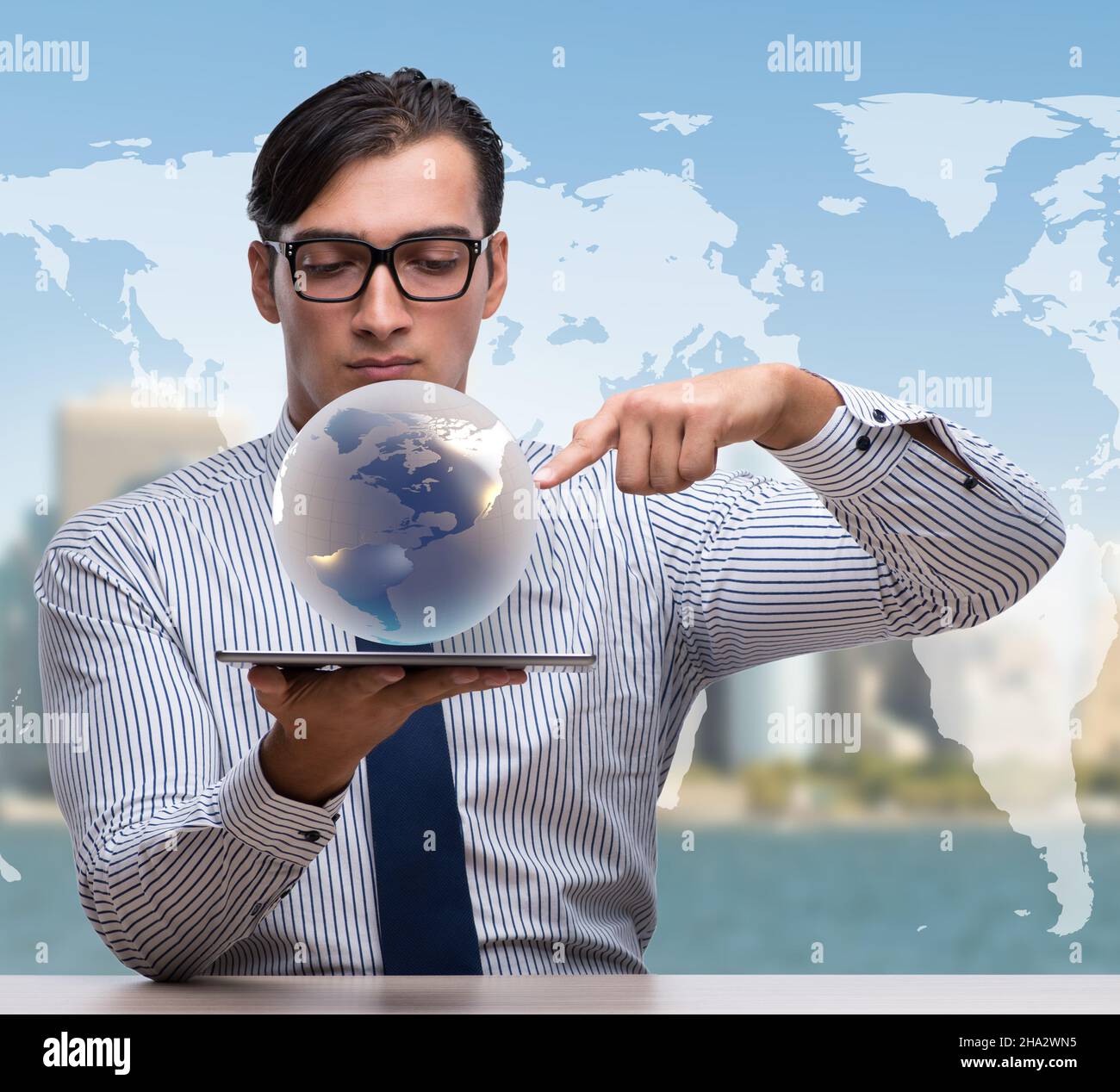 The businessman holding globe in global business concept Stock Photo ...