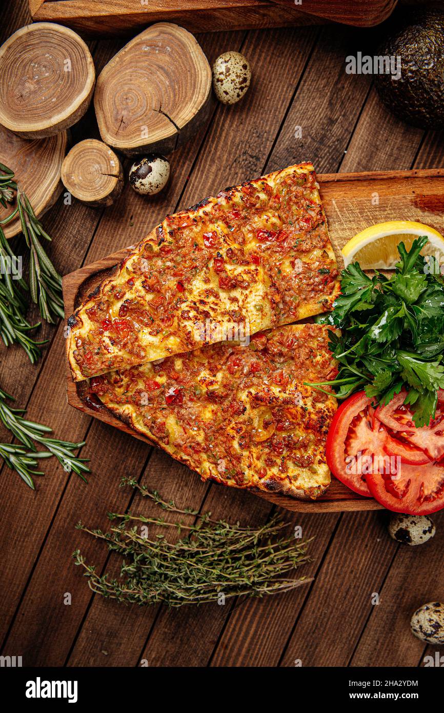 Turkish lahmacun pizza with mince and tomatoes Stock Photo
