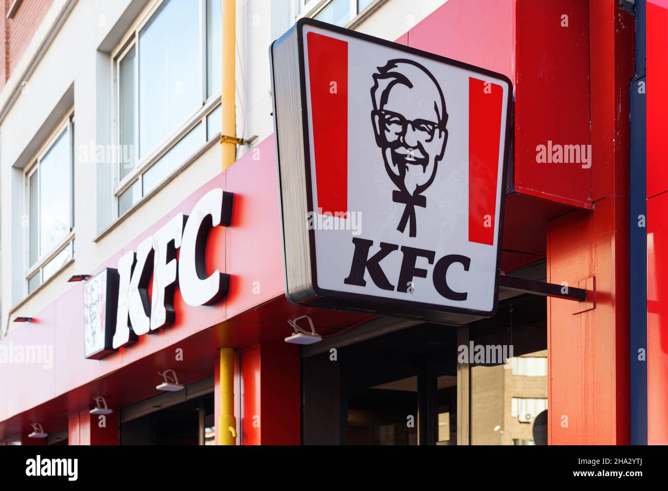 VALENCIA, SPAIN - DECEMBER 09, 2021: KFC is an American fast food restaurant chain that specializes in fried chicken Stock Photo