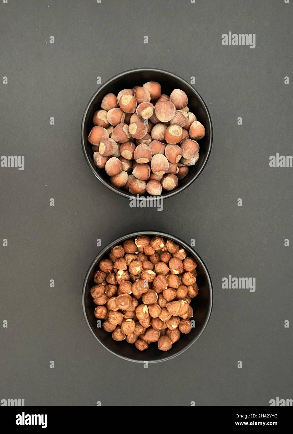 Nuts, hazelnuts in abowl with black background. Food concept and idea. Stock Photo