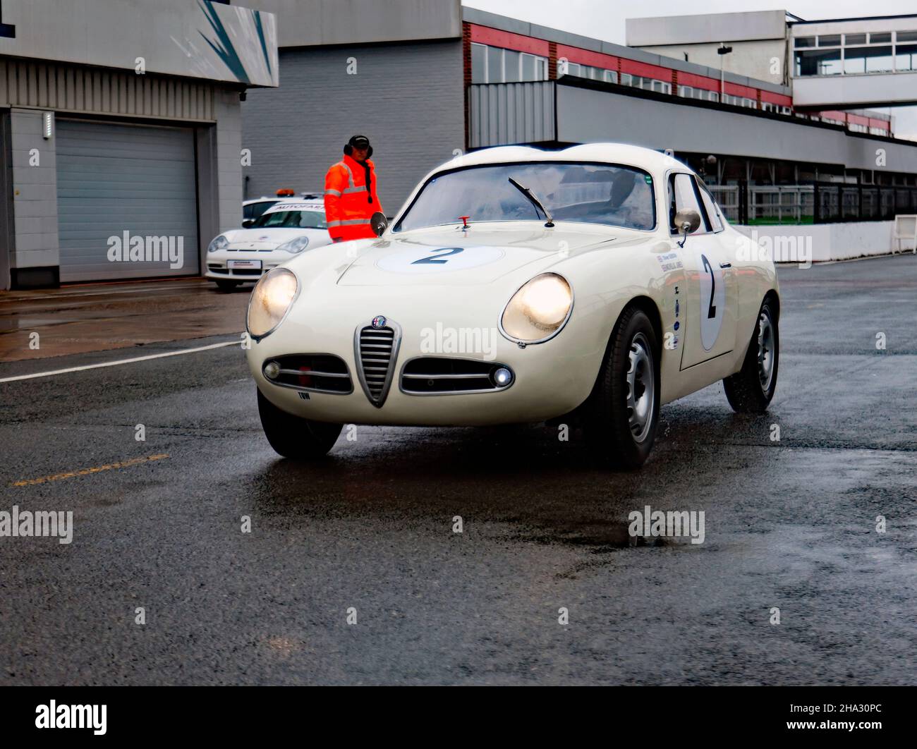 The White and Cream, 1957, Alfa Romeo SVZ, qualifying, in the rain, for the RAC Club Tourist Trophy for Historic Cars (MRL Pre '63 GT), Stock Photo