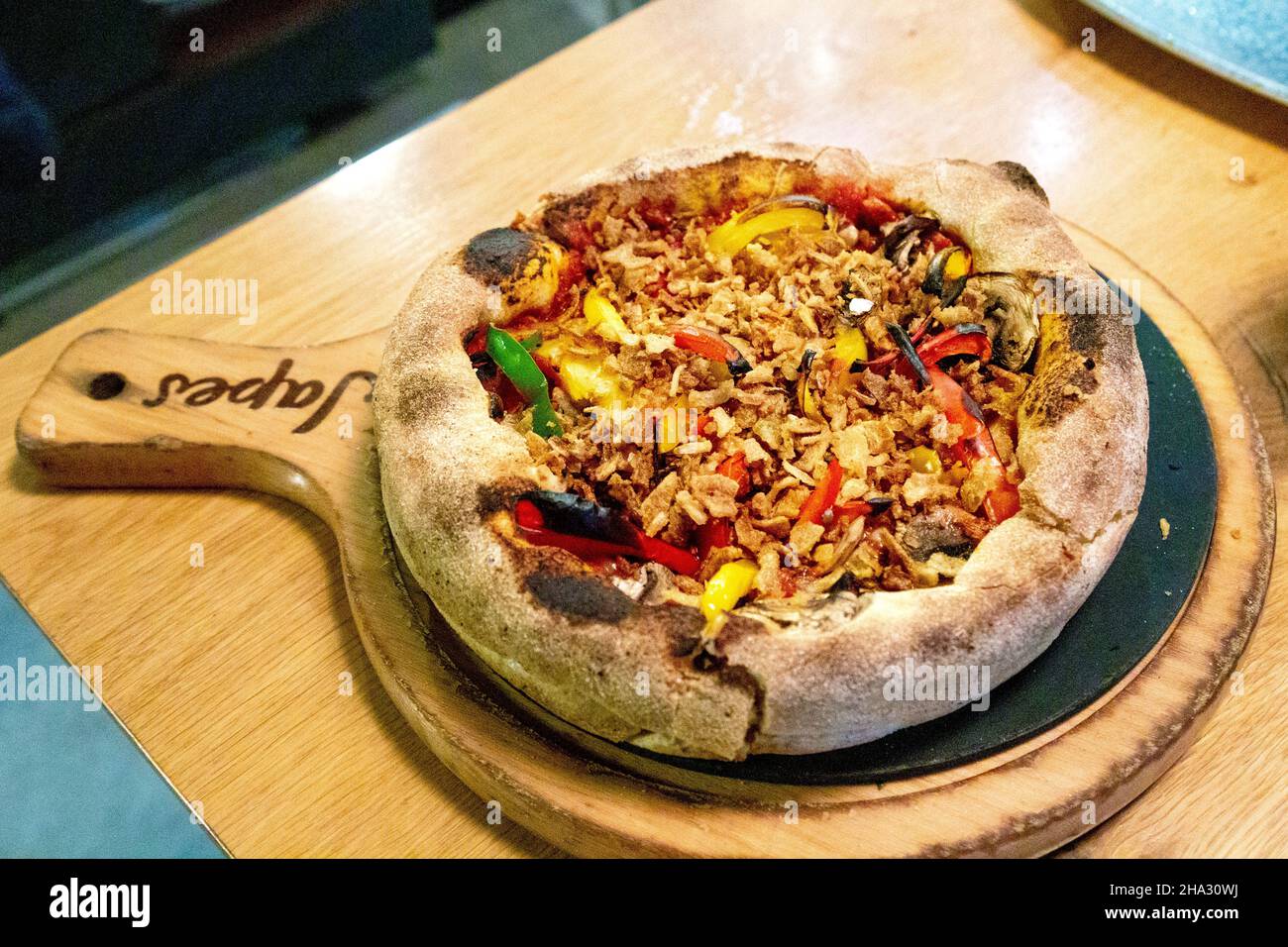 Vegan Delish pizza at Chicago-style deep-dish pizza restaurant Japes, Soho, London, UK Stock Photo