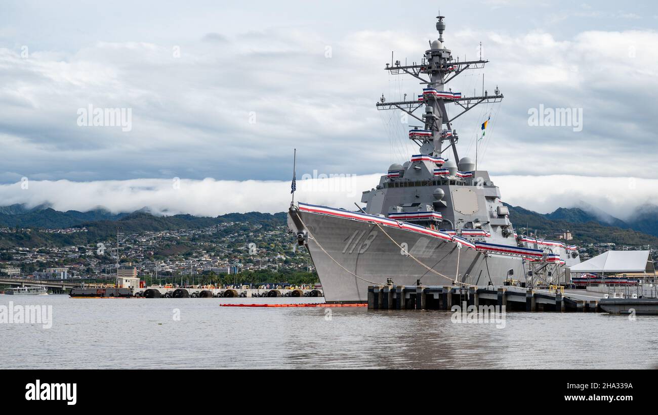 HONOLULU (Dec. 7, 2021) — The Arleigh Burke-class guided-missile destroyer USS Daniel Inouye (DDG 118) is moored at Joint Base Pearl Harbor-Hickam, Hawaii, Dec. 7, 2021, a day before it’s commissioning ceremony. Inouye’s namesake, the late Senator Daniel Inouye, was a U.S. senator from Hawaii who served in congress from 1962 until his death in 2012. During World War II, Inouye served in the U.S. Army’s 442nd Regimental Combat Team, one of the most decorated military units in U.S. history; for his heroism, he was awarded the Medal of Honor. (U.S. Navy photo by Mass Communication Specialist 2nd Stock Photo