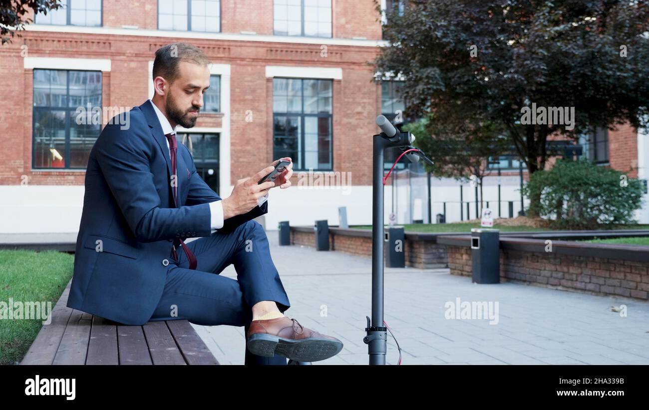Executive manager holding laptop computer browsing business information ...