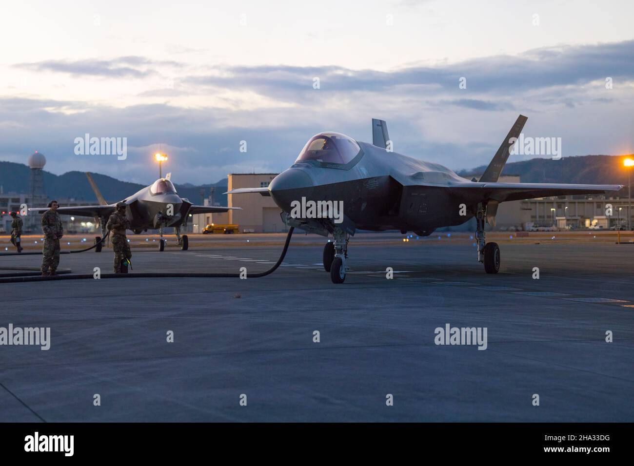 U.S. Airmen with the 356th Aircraft Maintenance Unit and 18th Logistics Readiness Squadron, prepare to refuel an F-35A Lightning II Aircraft during a Forward Area and Refueling Point at Marine Corps Air Station (MCAS) Iwakuni, Japan, Dec. 8, 2021. Airmen with the 354th Fighter Wing conducted a Forward Area Refueling Point with 1st Special Operations and 18th Logistics Readiness Squadron while deployed to MCAS Iwakuni, Japan, to simulate expeditionary refueling while operating in Forward deployed environments. (U.S. Marine Corps photo by Lance Cpl. Tyler Harmon) Stock Photo