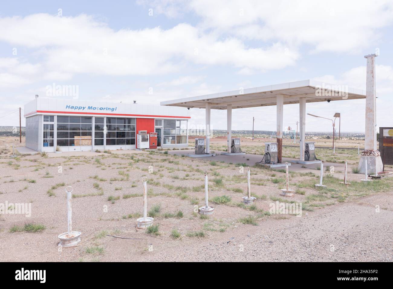 Tucumcari, New Mexico, NM Old Abandoned gas station with the words "Happy Motoring" on the